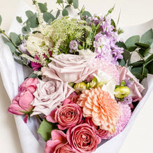 Load image into Gallery viewer, Designer's Selection flower bouquet wrapped in tissue and kraft paper. Featuring quicksand rose, spray rose, dahlia, freesia, stock, and eucalyptus. - Designer's Selection, Hand-tied Bouquet