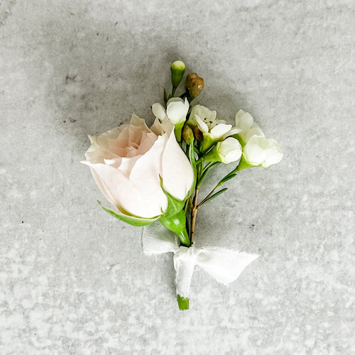 San Francisco wedding florist Flower Lab Design. Classic wedding boutonniere in blush pink for the ring bearer