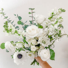 Load image into Gallery viewer, Elegant all-white bridal bouquet featuring roses, ranunculus, and anemone, designed in a refined garden-style, created by San Francisco wedding florist - Bridal Bouquet
