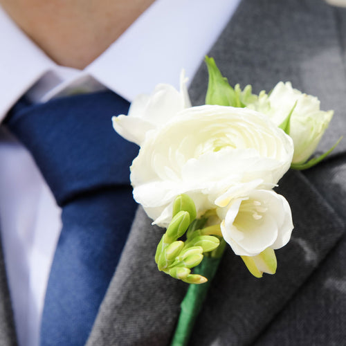 San Francisco wedding florist Flower Lab Design. Classic wedding boutonniere in white for the groom - Classic Boutonniere