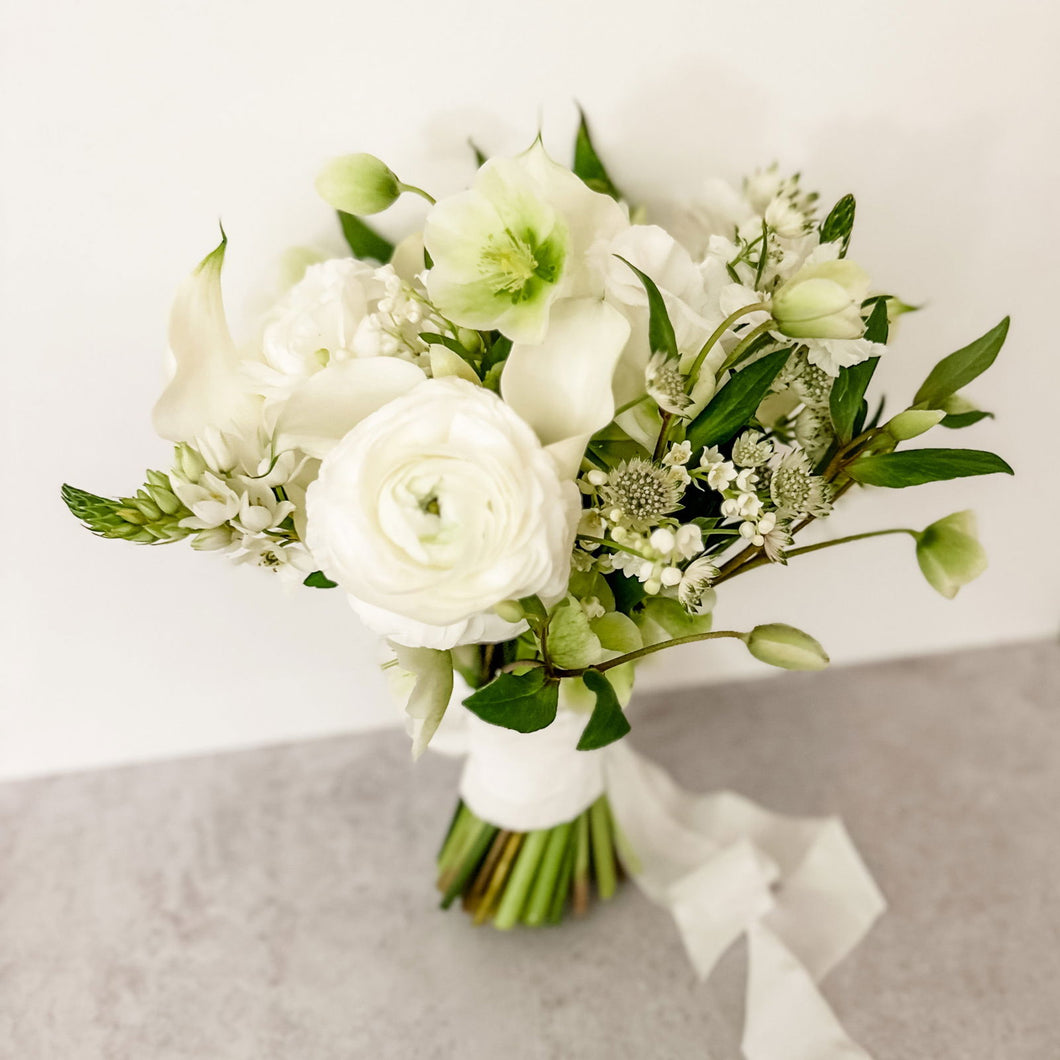 san francisco wedding florist bride bouquet all white color palette features ranunculus, astrantia, calla lily, hellebore - Bridal Bouquet